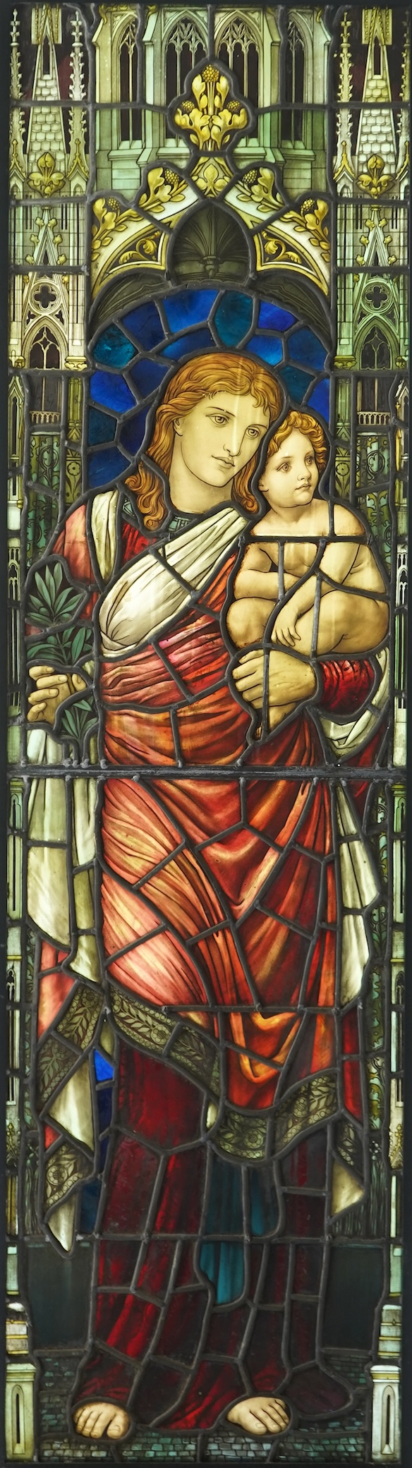 Attributed to Henry Holiday (1839-1927) for James Powell & Son: A stained and painted glass panel depicting the Virgin and Child